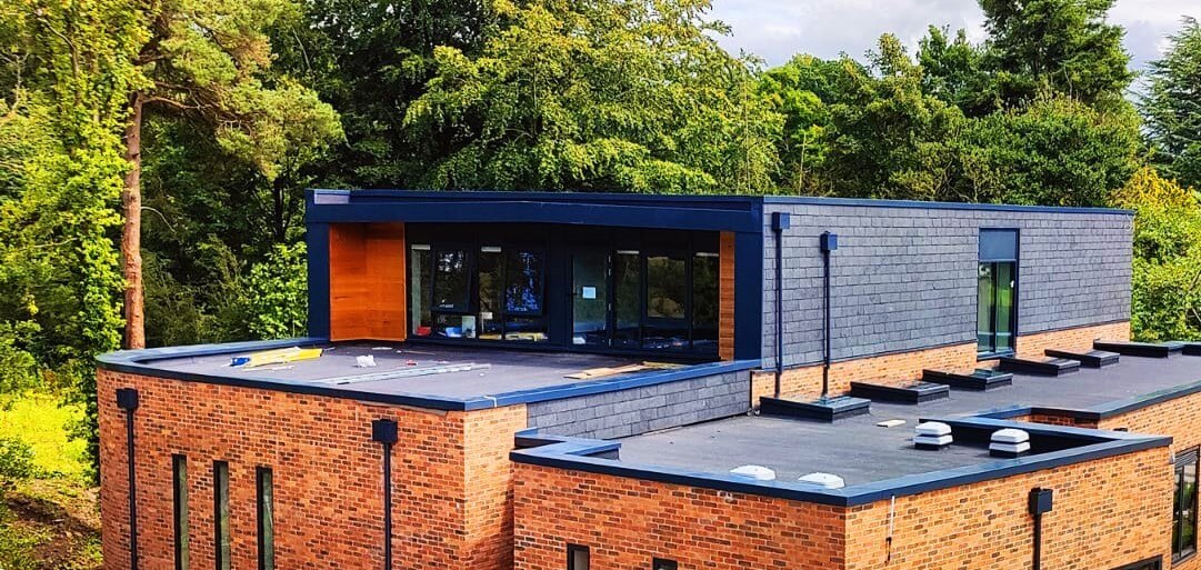 Aluminium wall cappings, downpipes and hoppers on new-build theatre facilities at a private school in Lancashire